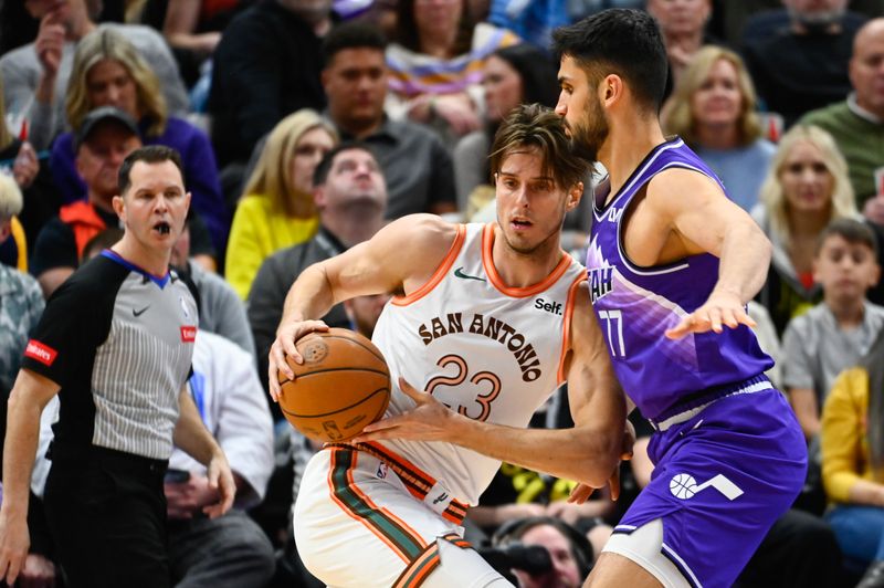 SALT LAKE CITY, UTAH - FEBRUARY 25: Zach Collins #23 of the San Antonio Spurs drives into Omer Yurtseven #77 of the Utah Jazz during the second half at Delta Center on February 25, 2024 in Salt Lake City, Utah. NOTE TO USER: User expressly acknowledges and agrees that, by downloading and or using this photograph, User is consenting to the terms and conditions of the Getty Images License Agreement. (Photo by Alex Goodlett/Getty Images)