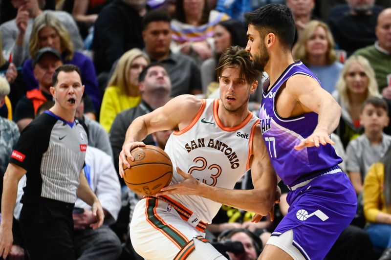 SALT LAKE CITY, UTAH - FEBRUARY 25: Zach Collins #23 of the San Antonio Spurs drives into Omer Yurtseven #77 of the Utah Jazz during the second half at Delta Center on February 25, 2024 in Salt Lake City, Utah. NOTE TO USER: User expressly acknowledges and agrees that, by downloading and or using this photograph, User is consenting to the terms and conditions of the Getty Images License Agreement. (Photo by Alex Goodlett/Getty Images)