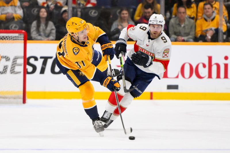 Feb 25, 2025; Nashville, Tennessee, USA;  Nashville Predators defenseman Nick Blankenburg (37) passes the puck against the Florida Panthers during the first period at Bridgestone Arena. Mandatory Credit: Steve Roberts-Imagn Images