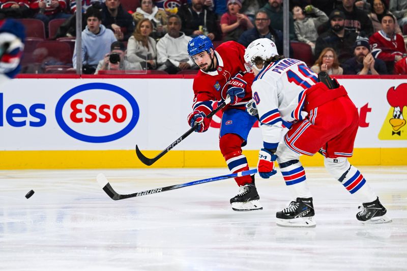 Jan 19, 2025; Montreal, Quebec, CAN; Montreal Canadiens defenseman Alexandre Carrier (45) shoots the puck against New York Rangers left wing Artemi Panarin (10) during the second period at Bell Centre. Mandatory Credit: David Kirouac-Imagn Images