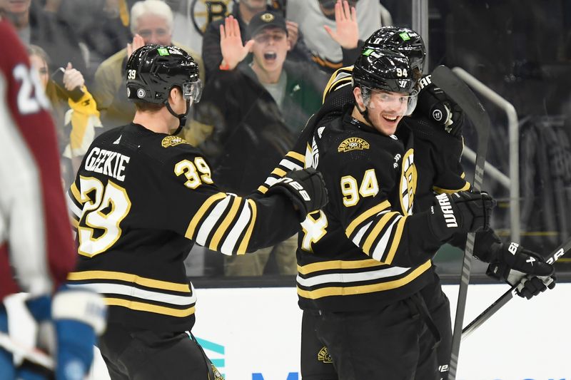 Jan 18, 2024; Boston, Massachusetts, USA; Boston Bruins center Morgan Geekie (39) congratulates center Jakub Lauko (94) after scoring a goal during the first period against the Colorado Avalanche at TD Garden. Mandatory Credit: Bob DeChiara-USA TODAY Sports