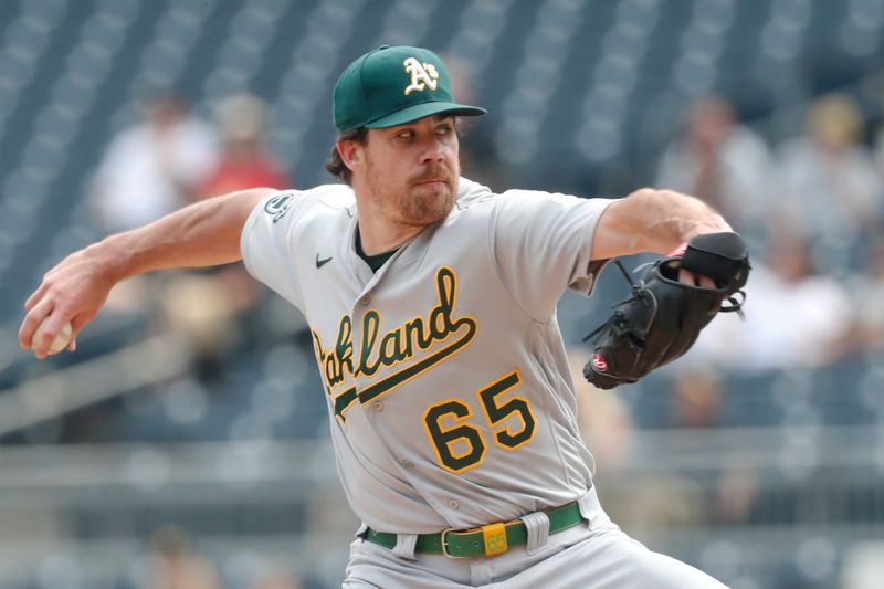 Jun 7, 2023; Pittsburgh, Pennsylvania, USA;  Oakland Athletics relief pitcher Trevor May (65) throws against the Pittsburgh Pirates during the ninth inning at PNC Park. Oakland won 9-5. Mandatory Credit: Charles LeClaire-USA TODAY Sports