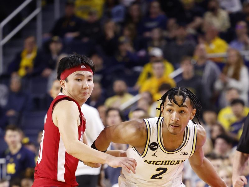 Feb 8, 2023; Ann Arbor, Michigan, USA;  Michigan Wolverines guard Kobe Bufkin (2) dribbles defended by Nebraska Cornhuskers guard Keisei Tominaga (30) in the first half at Crisler Center. Mandatory Credit: Rick Osentoski-USA TODAY Sports