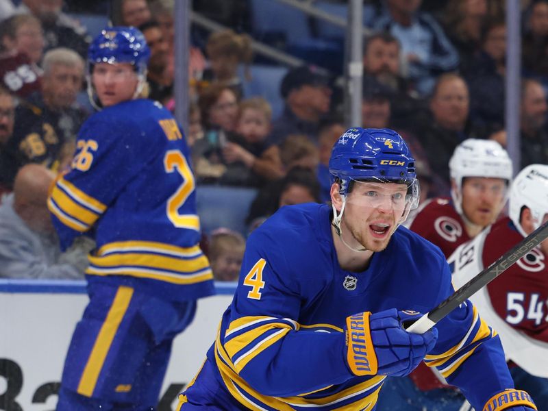 Oct 13, 2025; Buffalo, New York, USA;  Buffalo Sabres defenseman Bowen Byram (4) looks for the puck during the third period against the Colorado Avalanche at KeyBank Center. Mandatory Credit: Timothy T. Ludwig-Imagn Images