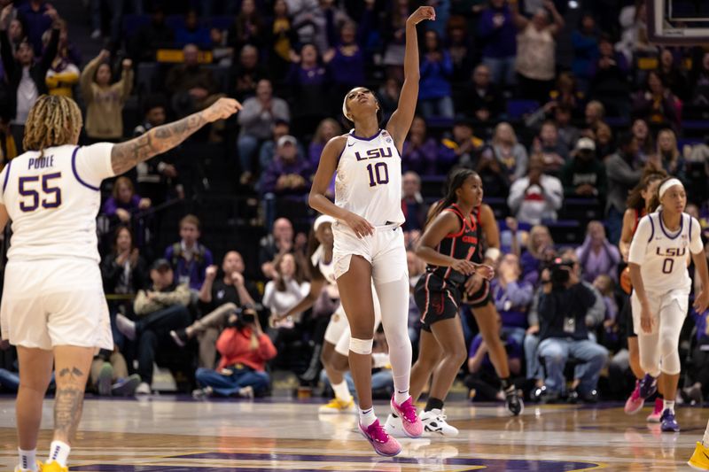 Feb 2, 2023; Baton Rouge, Louisiana, USA;  LSU Lady Tigers forward Angel Reese (10) reacts to making a free throw against the Georgia Lady Bulldogs during overtime at Pete Maravich Assembly Center. Mandatory Credit: Stephen Lew-USA TODAY Sports