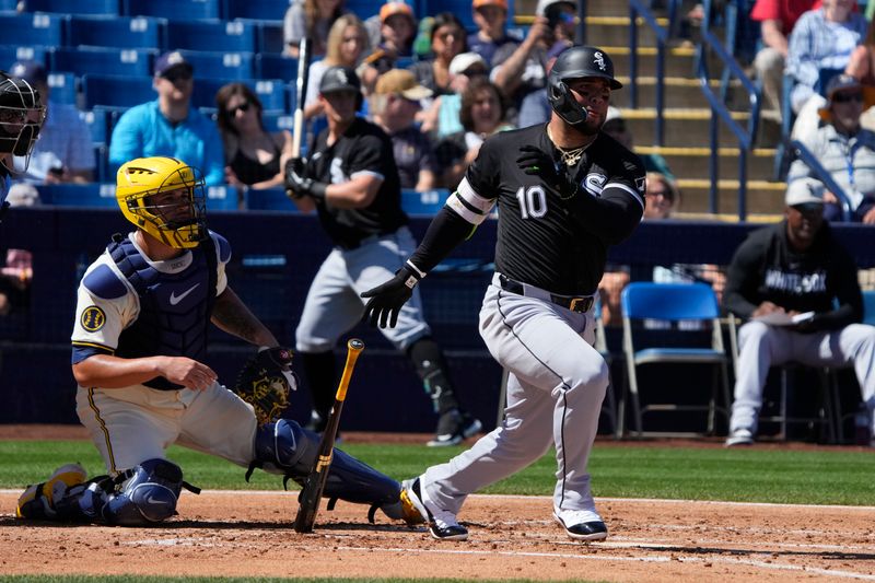 Mar 13, 2024; Phoenix, Arizona, USA; Chicago White Sox third baseman Yoan Moncada (10) hits against the Milwaukee Brewers in the first inning at American Family Fields of Phoenix. Mandatory Credit: Rick Scuteri-USA TODAY Sports