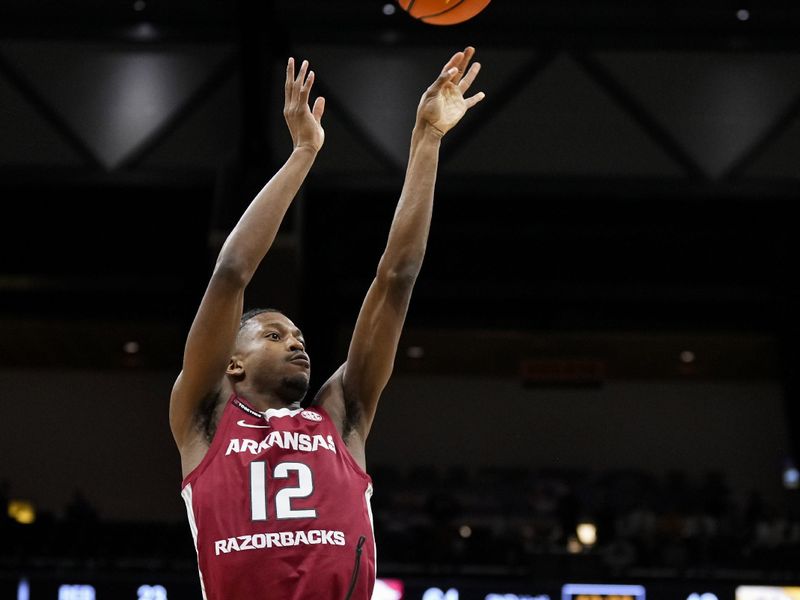 Jan 31, 2024; Columbia, Missouri, USA; Arkansas Razorbacks guard Tramon Mark (12) shoots against Missouri Tigers guard Sean East II (55) during the second half at Mizzou Arena. Mandatory Credit: Jay Biggerstaff-USA TODAY Sports