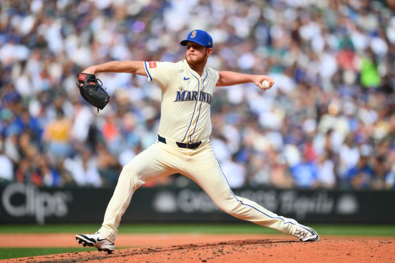 Sep 28, 2025; Seattle, Washington, USA; Seattle Mariners relief pitcher Caleb Ferguson (43) pitches to the Los Angeles Dodgers during the fifth inning at T-Mobile Park. Mandatory Credit: Steven Bisig-Imagn Images