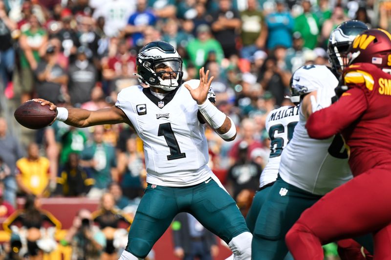 Philadelphia Eagles quarterback Jalen Hurts (1) passes the ball during the first half of an NFL football game against the Washington Commanders, Sunday, Oct. 29, 2023, in Landover, Md. (AP Photo/Terrance Williams)