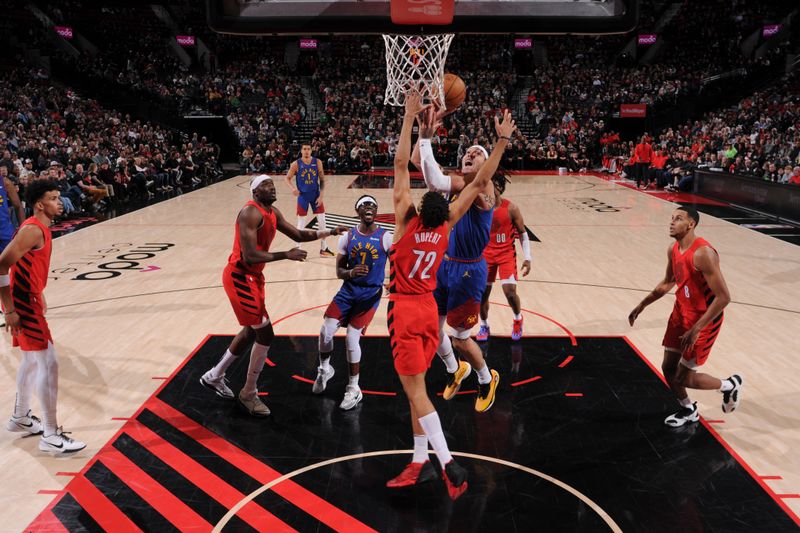 PORTLAND, OR - MARCH 23: Aaron Gordon #50 of the Denver Nuggets drives to the basket during the game against the Portland Trail Blazers on March 23, 2024 at the Moda Center Arena in Portland, Oregon. NOTE TO USER: User expressly acknowledges and agrees that, by downloading and or using this photograph, user is consenting to the terms and conditions of the Getty Images License Agreement. Mandatory Copyright Notice: Copyright 2024 NBAE (Photo by Cameron Browne/NBAE via Getty Images)