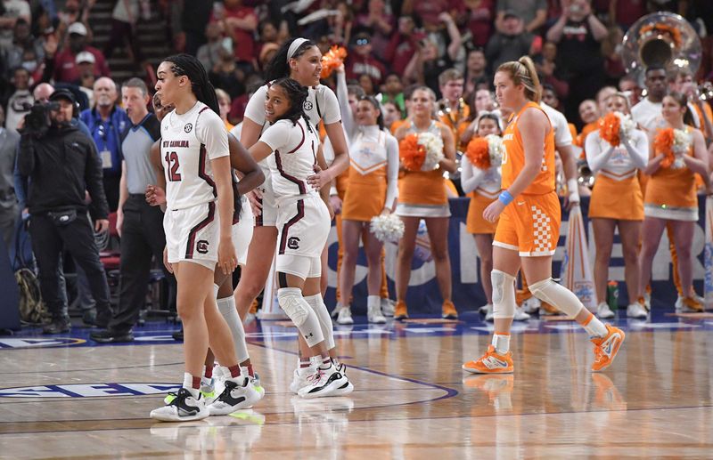 Mar 5, 2023; Greenville, SC, USA; South Carolina guard Brea Beal (12), guard Zia Cooke (1) and center Kamilla Cardoso (10) celebrate near Tennessee forward Tess Darby (21) after the SEC Women's Basketball Tournament at Bon Secours Wellness Arena. Mandatory Credit: Ken Ruinard-USA TODAY Sports