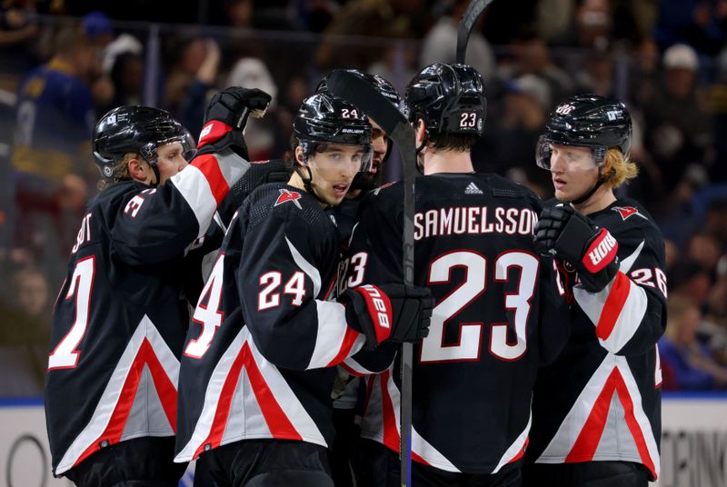 Jan 11, 2024; Buffalo, New York, USA;  Buffalo Sabres center Dylan Cozens (24) celebrates his goal with teammates during the third period against the Ottawa Senators at KeyBank Center. Mandatory Credit: Timothy T. Ludwig-USA TODAY Sports