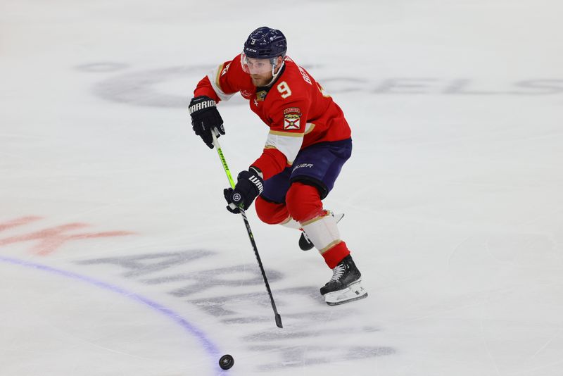 Apr 11, 2024; Sunrise, Florida, USA; Florida Panthers center Sam Bennett (9) moves the puck against the Columbus Blue Jackets during the first period at Amerant Bank Arena. Mandatory Credit: Sam Navarro-USA TODAY Sports