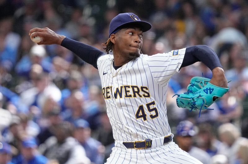 May 4, 2025; Milwaukee, Wisconsin, USA; Milwaukee Brewers pitcher Abner Uribe (45) delivers a pitch against the Chicago Cubs in the eighth inning at American Family Field. Mandatory Credit: Michael McLoone-Imagn Images