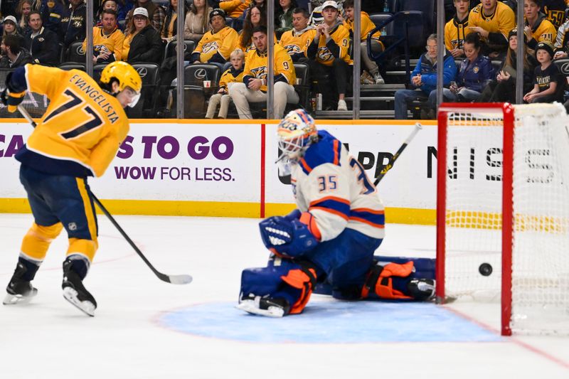 Jan 13, 2026; Nashville, Tennessee, USA;  Edmonton Oilers goaltender Tristan Jarry (35) blocks the shot of Nashville Predators right wing Luke Evangelista (77) during the third period at Bridgestone Arena. Mandatory Credit: Steve Roberts-Imagn Images