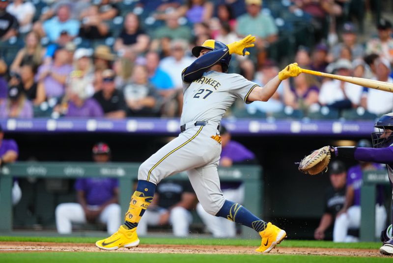 Jul 1, 2024; Denver, Colorado, USA; Milwaukee Brewers shortstop Willy Adames (27) RBI singles during the fourth iinning against the Colorado Rockies at Coors Field. Mandatory Credit: Ron Chenoy-USA TODAY Sports