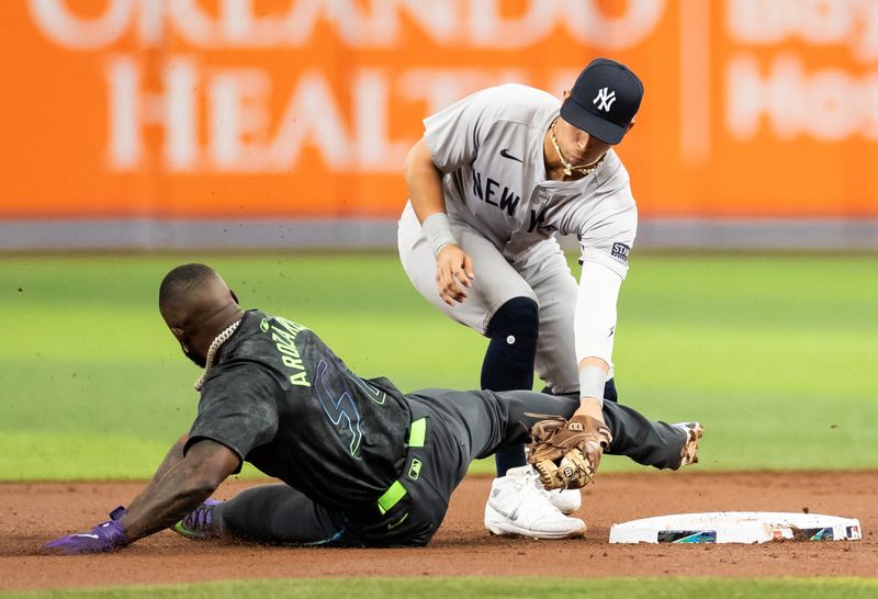 May 11, 2024; St. Petersburg, Florida, USA; New York Yankees third base Oswaldo Cabrera (95) tags out Tampa Bay Rays outfielder Randy Arozarena (56) during the first inning at Tropicana Field. Mandatory Credit: Matt Pendleton-USA TODAY Sports