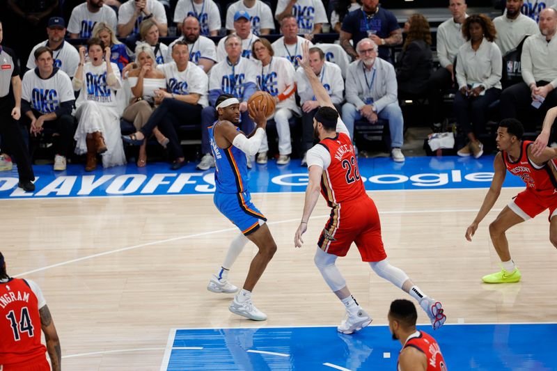 OKLAHOMA CITY, OK - APRIL 24: Shai Gilgeous-Alexander #2 of the Oklahoma City Thunder handles the ball during the game against the New Orleans Pelicans during Round 1 Game 2 of the 2024 NBA Playoffs on April 24, 2024 at Paycom Arena in Oklahoma City, Oklahoma. NOTE TO USER: User expressly acknowledges and agrees that, by downloading and or using this photograph, User is consenting to the terms and conditions of the Getty Images License Agreement. Mandatory Copyright Notice: Copyright 2024 NBAE (Photo by Martin McGrew/NBAE via Getty Images)