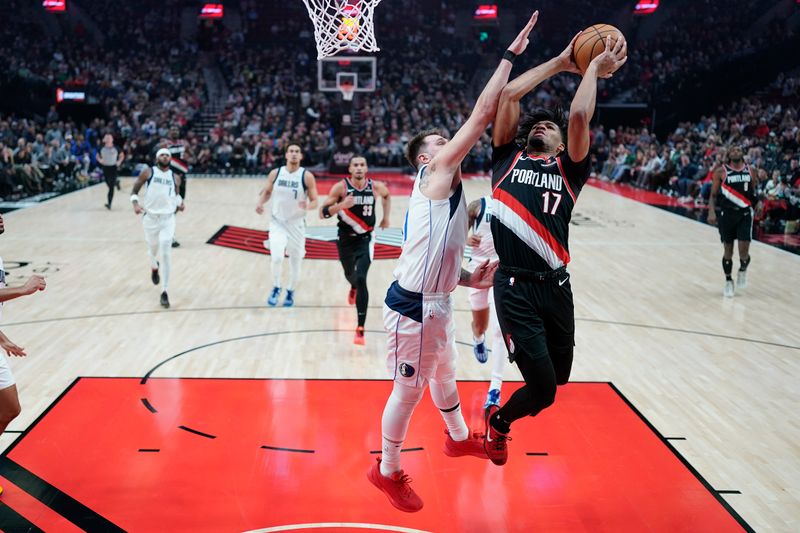 PORTLAND, OREGON - DECEMBER 01: Shaedon Sharpe #17 of the Portland Trail Blazers shoots the ball against Luka Doncic (L) #77 of the Dallas Mavericks during the first half at Moda Center on December 01, 2024 in Portland, Oregon. NOTE TO USER: User expressly acknowledges and agrees that, by downloading and or using this photograph, User is consenting to the terms and conditions of the Getty Images License Agreement. (Photo by Soobum Im/Getty Images)