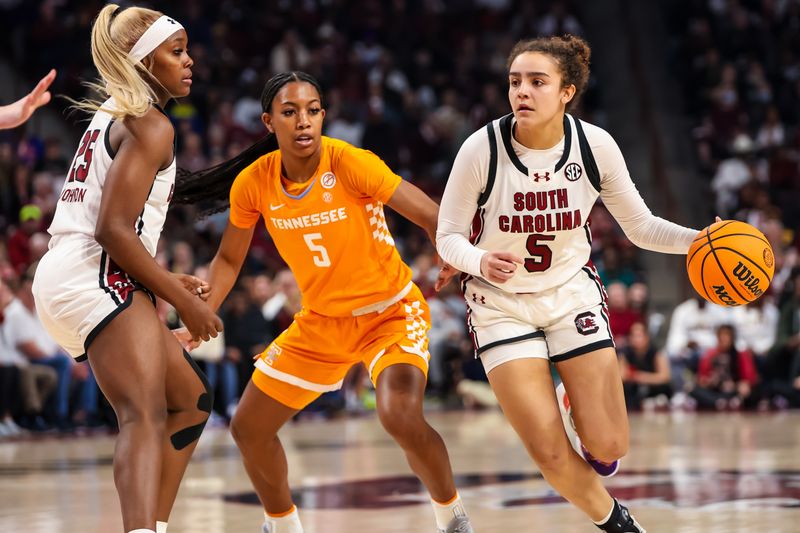 Mar 3, 2024; Columbia, South Carolina, USA; South Carolina Gamecocks guard Tessa Johnson (5) drives around Tennessee Lady Vols guard Kaiya Wynn (5) in the first half at Colonial Life Arena. Mandatory Credit: Jeff Blake-USA TODAY Sports