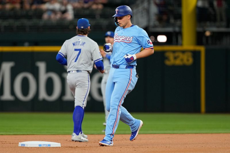 Jun 23, 2024; Arlington, Texas, USA; Texas Rangers shortstop Corey Seager (5) arrives to second base on his double against the Kansas City Royals during the first inning at Globe Life Field. Mandatory Credit: Jim Cowsert-USA TODAY Sports