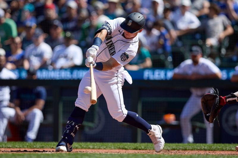 Aug 2, 2023; Seattle, Washington, USA; Seattle Mariners  Cade Marlowe hits an RBI single against the Boston Red Sox during the seventh inning at T-Mobile Park. Mandatory Credit: John Froschauer-USA TODAY Sports