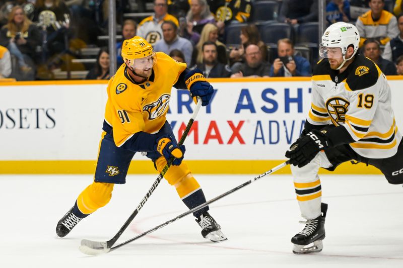 Oct 22, 2024; Nashville, Tennessee, USA;  Boston Bruins center John Beecher (19) blocks the shot of Nashville Predators center Steven Stamkos (91) during the first period at Bridgestone Arena. Mandatory Credit: Steve Roberts-Imagn Images