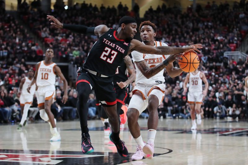 Feb 13, 2023; Lubbock, Texas, USA;  Texas Tech Red Raiders guard De   Vion Harmon (23) steals the ball from Texas Longhorns guard Artery Morris (2) in the second half at United Supermarkets Arena. Mandatory Credit: Michael C. Johnson-USA TODAY Sports