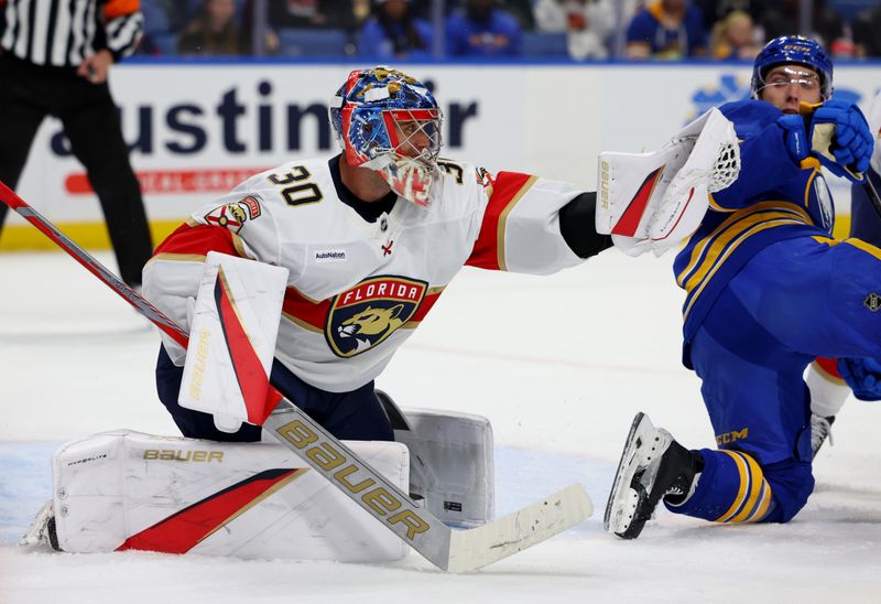 Oct 12, 2024; Buffalo, New York, USA;  Florida Panthers goaltender Spencer Knight (30) makes a glove save during the second period against the Buffalo Sabres at KeyBank Center. Mandatory Credit: Timothy T. Ludwig-Imagn Images