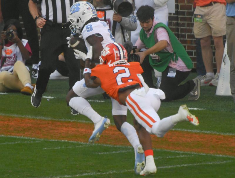 Nov 18, 2023; Clemson, South Carolina, USA; North Carolina Tar Heels wide receiver Devontez Walker (9) catches a pass against Clemson Tigers cornerback Nate Wiggins (2) during the first quarter at Memorial Stadium. Mandatory Credit: Ken Ruinard-USA TODAY Sports