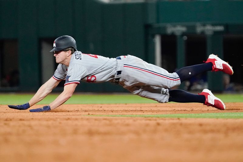 Sep 1, 2023; Arlington, Texas, USA; Minnesota Twins outfield Andrew Stevenson (45) slides into second with a stolen base during the ninth inning against the Texas Rangers at Globe Life Field. Mandatory Credit: Raymond Carlin III-USA TODAY Sports