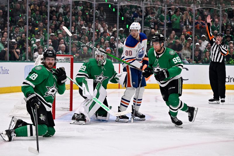 May 21, 2025; Dallas, Texas, USA; Edmonton Oilers right wing Corey Perry (90) is called for a high stick on Dallas Stars center Sam Steel (18) in the third period during game one of the Western Conference Final of the 2025 Stanley Cup Playoffs at American Airlines Center. Mandatory Credit: Jerome Miron-Imagn Images