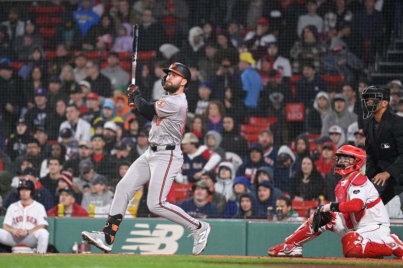 Apr 11, 20024; Boston, Massachusetts, USA; Baltimore Orioles left fielder Colton Cowser (17) hits a home run against the Boston Red Sox during the fifth inning at Fenway Park. Mandatory Credit: Eric Canha-USA TODAY Sports