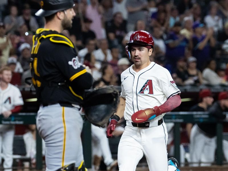 May 27, 2025; Phoenix, Arizona, USA; Arizona Diamondbacks base runner Corbin Carroll scores in the fourth inning against the Pittsburgh Pirates at Chase Field. Mandatory Credit: Mark J. Rebilas-Imagn Images