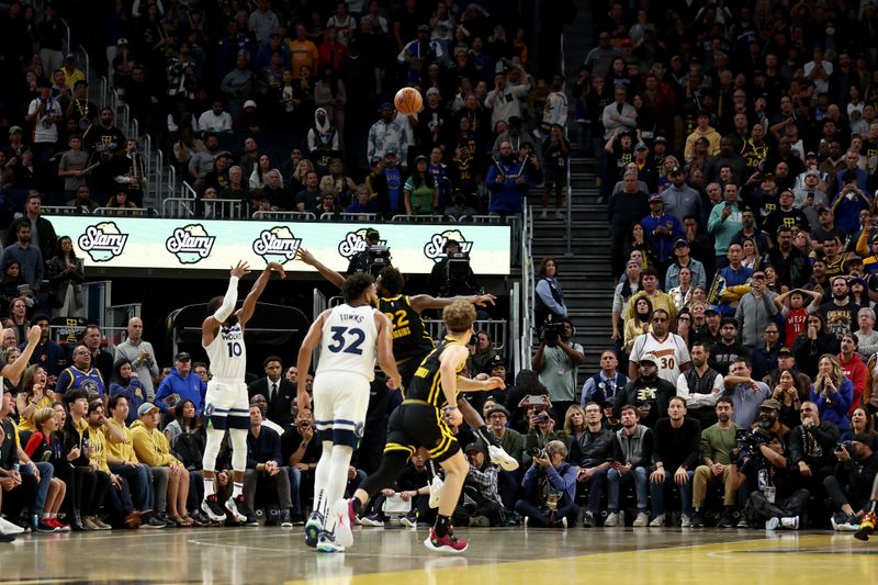 SAN FRANCISCO, CALIFORNIA - NOVEMBER 14: Mike Conley #10 of the Minnesota Timberwolves makes a three-point basket near the end of regulation of their game against the Golden State Warriors at Chase Center on November 14, 2023 in San Francisco, California. NOTE TO USER: User expressly acknowledges and agrees that, by downloading and or using this photograph, User is consenting to the terms and conditions of the Getty Images License Agreement.  (Photo by Ezra Shaw/Getty Images)