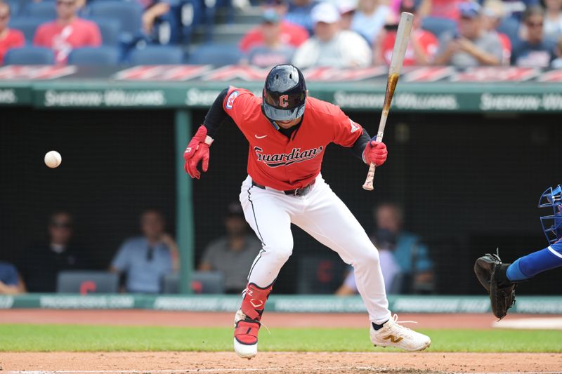 Aug 28, 2024; Cleveland, Ohio, USA; Cleveland Guardians second baseman Andres Gimenez (0) is hit by a pitch during the first inning against the Kansas City Royals at Progressive Field. Mandatory Credit: Ken Blaze-USA TODAY Sports