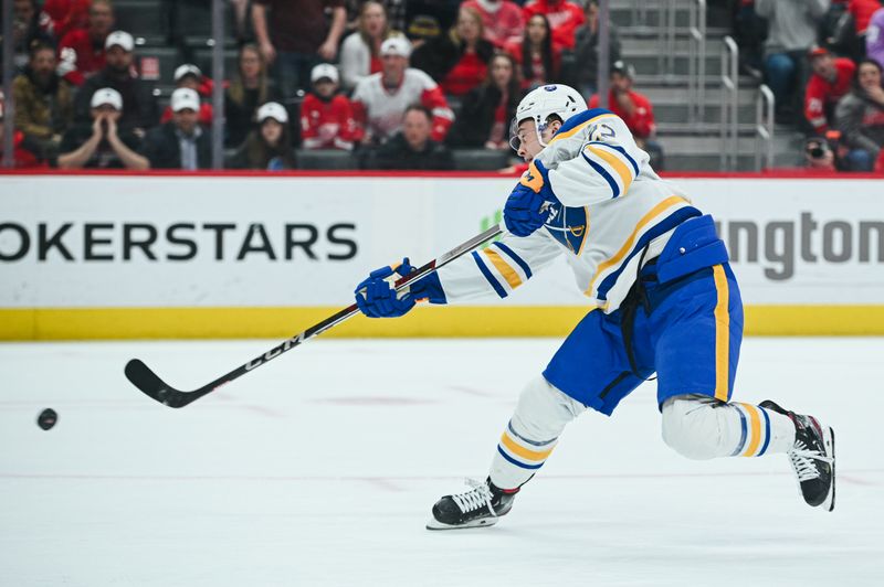 Apr 6, 2023; Detroit, Michigan, USA; Buffalo Sabres right wing Jack Quinn (22) scores a goal during a shootout against the Detroit Red Wings at Little Caesars Arena. Mandatory Credit: Tim Fuller-USA TODAY Sports