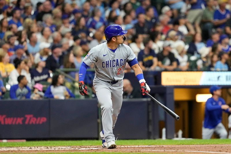 Jun 28, 2024; Milwaukee, Wisconsin, USA;  Chicago Cubs designated hitter Seiya Suzuki (27) hits a home run during the fourth inning against the Milwaukee Brewers at American Family Field. Mandatory Credit: Jeff Hanisch-USA TODAY Sports