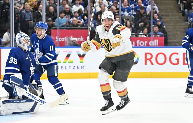 Feb 27, 2024; Toronto, Ontario, CAN;  Vegas Golden Knights forward Mason Morelli (11) celebrates after scoring a goal past Toronto Maple Leafs goalie Ilya Samsonov (35) in the second period at Scotiabank Arena. Mandatory Credit: Dan Hamilton-USA TODAY Sports