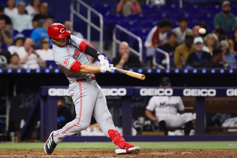 Aug 5, 2024; Miami, Florida, USA; Cincinnati Reds first baseman Ty France (2) hits a solo home run against the Miami Marlins during the fifth inning at loanDepot Park. Mandatory Credit: Sam Navarro-USA TODAY Sports