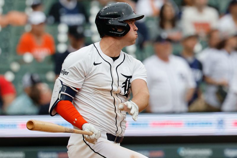 Sep 21, 2025; Detroit, Michigan, USA;  Detroit Tigers outfielder Kerry Carpenter (30) hits a single in the ninth inning against the Atlanta Braves at Comerica Park. Mandatory Credit: Rick Osentoski-Imagn Images