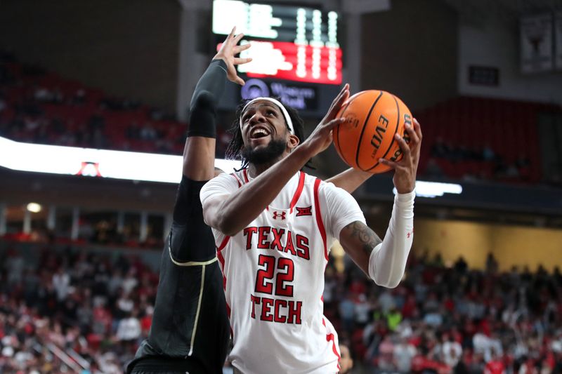 Feb 10, 2024; Lubbock, Texas, USA;  Texas Tech Red Raiders forward Warren Washington (22) goes to the basket against Central Florida Knights forward Omar Payne (5) in the second half at United Supermarkets Arena. Mandatory Credit: Michael C. Johnson-USA TODAY Sports