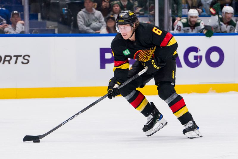 Dec 7, 2023; Vancouver, British Columbia, CAN; Vancouver Canucks forward Brock Boeser (6) handles the puck on a breakaway against the Minnesota Wild in the third period at Rogers Arena. Vancouver won 2-0. Mandatory Credit: Bob Frid-USA TODAY Sports