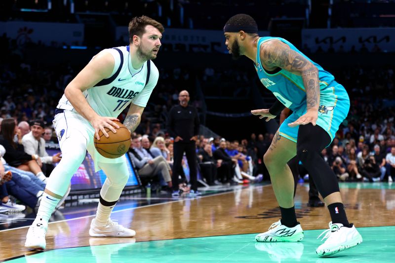 CHARLOTTE, NORTH CAROLINA - APRIL 09: Luka Doncic #77 of the Dallas Mavericks controls the ball during the second half of an NBA game against the Charlotte Hornets at Spectrum Center on April 09, 2024 in Charlotte, North Carolina. NOTE TO USER: User expressly acknowledges and agrees that, by downloading and or using this photograph, User is consenting to the terms and conditions of the Getty Images License Agreement. (Photo by David Jensen/Getty Images)