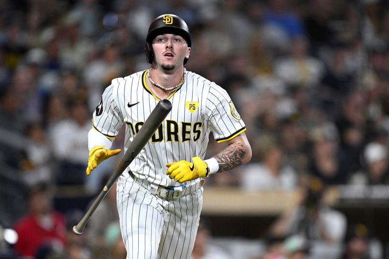 Aug 12, 2024; San Diego, California, USA; San Diego Padres center fielder Jackson Merrill (3) tosses his bat after flying out against the Pittsburgh Pirates during the fifth inning at Petco Park. Mandatory Credit: Orlando Ramirez-USA TODAY Sports