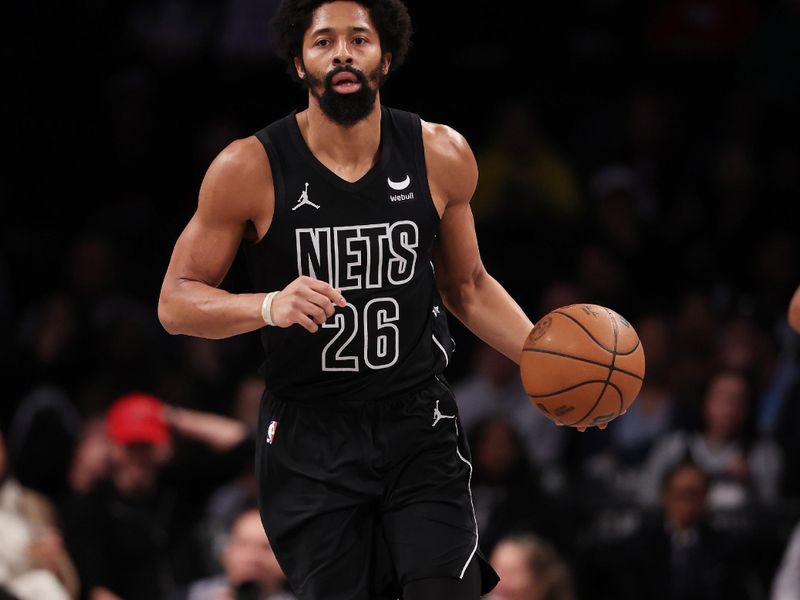 NEW YORK, NEW YORK - JANUARY 15:  Spencer Dinwiddie #26 of the Brooklyn Nets drives against the Miami Heat during their game at Barclays Center on January 15, 2024 in New York City.   User expressly acknowledges and agrees that, by downloading and or using this photograph, User is consenting to the terms and conditions of the Getty Images License Agreement.  (Photo by Al Bello/Getty Images)