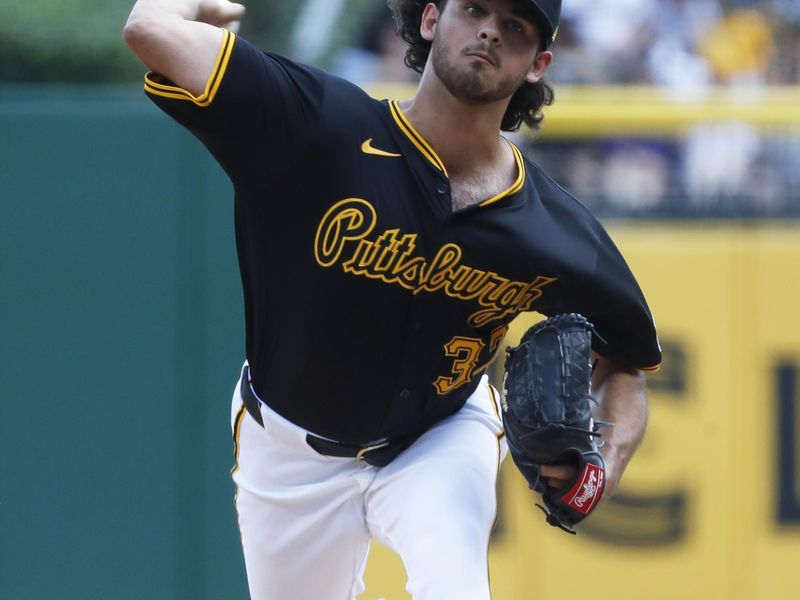 Jun 9, 2024; Pittsburgh, Pennsylvania, USA; Pittsburgh Pirates starting pitcher Jared Jones (37) delivers a pitch against the Minnesota Twins during the first inning at PNC Park. Mandatory Credit: Charles LeClaire-USA TODAY Sports