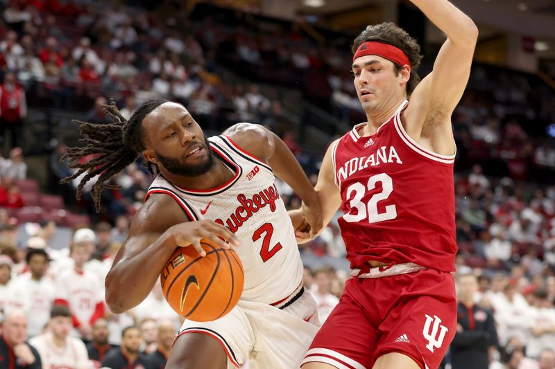 Jan 17, 2025; Columbus, Ohio, USA; Ohio State Buckeyes guard Bruce Thornton (2) drives to the basket as Indiana Hoosiers guard Trey Galloway (32) defends during the second half at Value City Arena. Mandatory Credit: Joseph Maiorana-Imagn Images