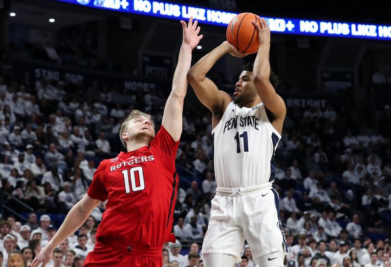 Feb 26, 2023; University Park, Pennsylvania, USA; Penn State Nittany Lions guard Camren Wynter (11) drives the ball to the basket as Rutgers Scarlet Knights guard Cam Spencer (10) defends during the first half at Bryce Jordan Center. Mandatory Credit: Matthew OHaren-USA TODAY Sports