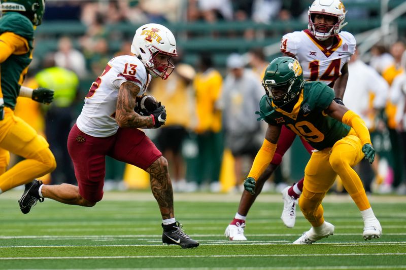 Oct 28, 2023; Waco, Texas, USA;  Iowa State Cyclones wide receiver Jaylin Noel (13) makes a catch against Baylor Bears cornerback Caden Jenkins (19) during the first half at McLane Stadium. Mandatory Credit: Chris Jones-USA TODAY Sports